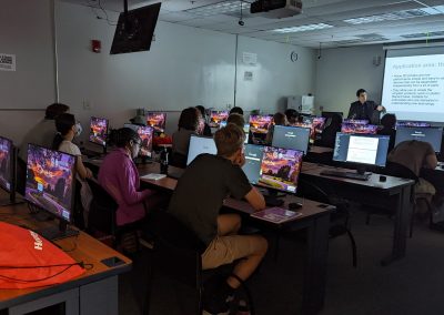 instructor giving a presentation inside a computer lab